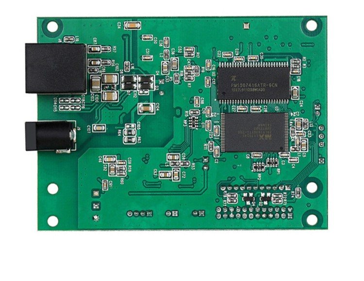 An assembled board with a black power connector, an edge connector and a large quad-flat-pack IC